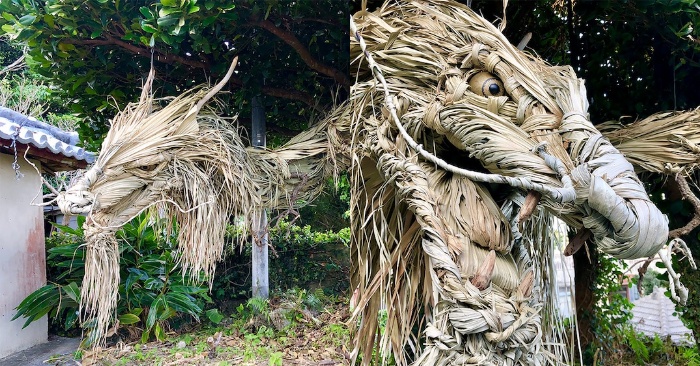  A massive Japanese dragon sculpture made of wood and palm tree leaves