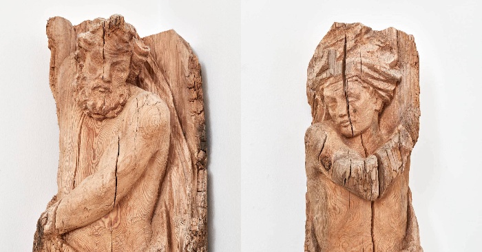  From wooden beams that once belonged to a historic German palace, carved figures emerge
